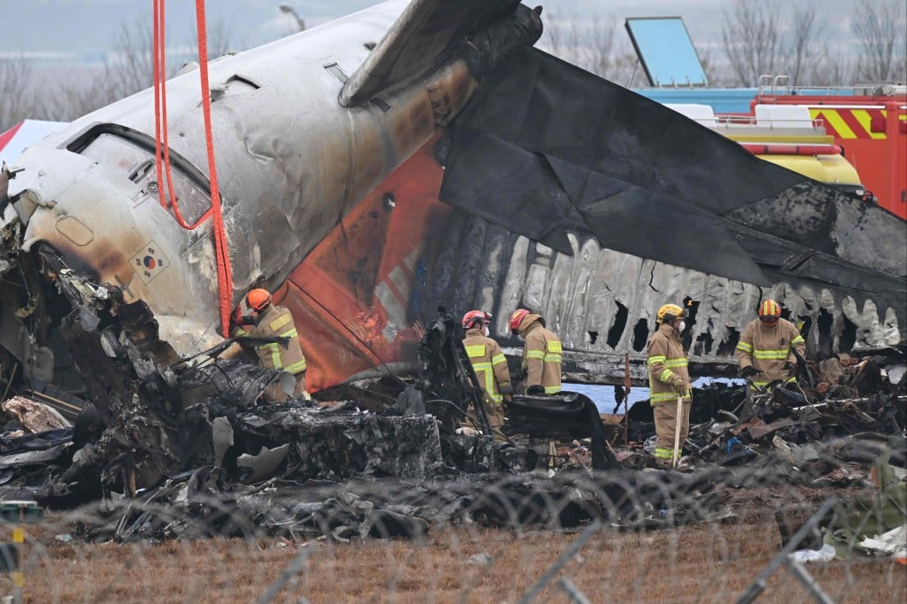 Firefighters and recovery teams work at the scene where a Jeju Air Boeing 737-800 series aircraft crashed and burst into flames at Muan International Airport. Photo: AFP