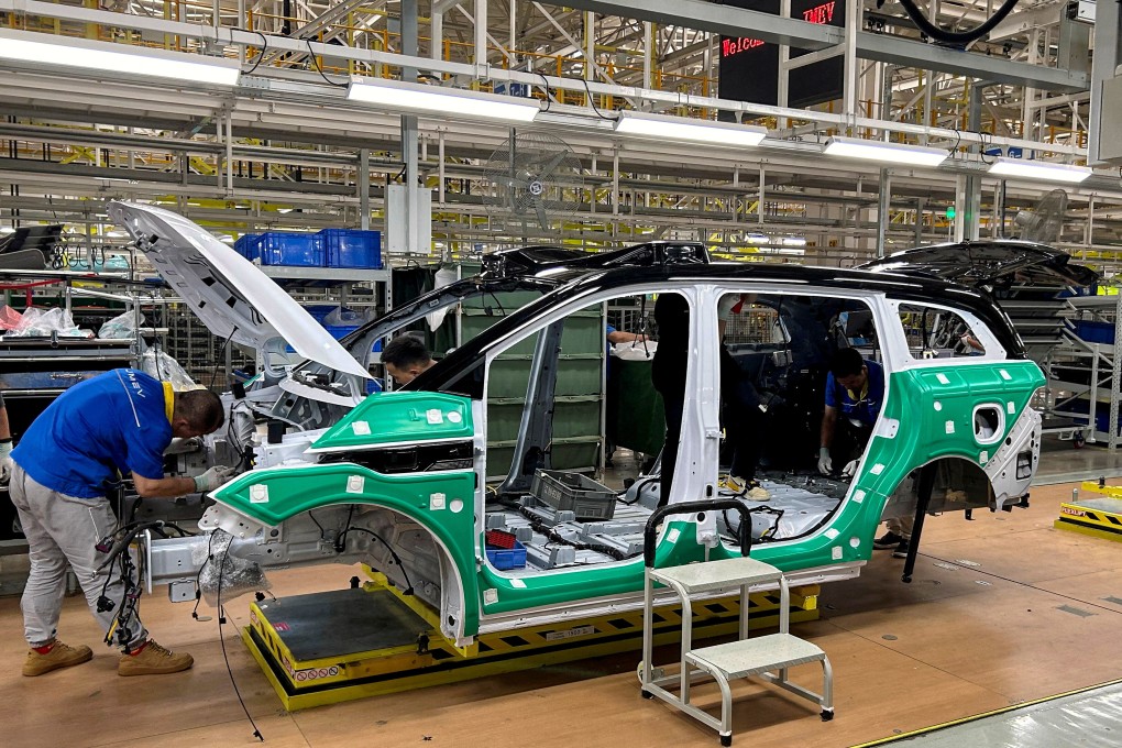 Employees work on an electric vehicle (EV) production line during an organised media tour to a factory in China’s Jiangxi province in May. Photo: Reuters