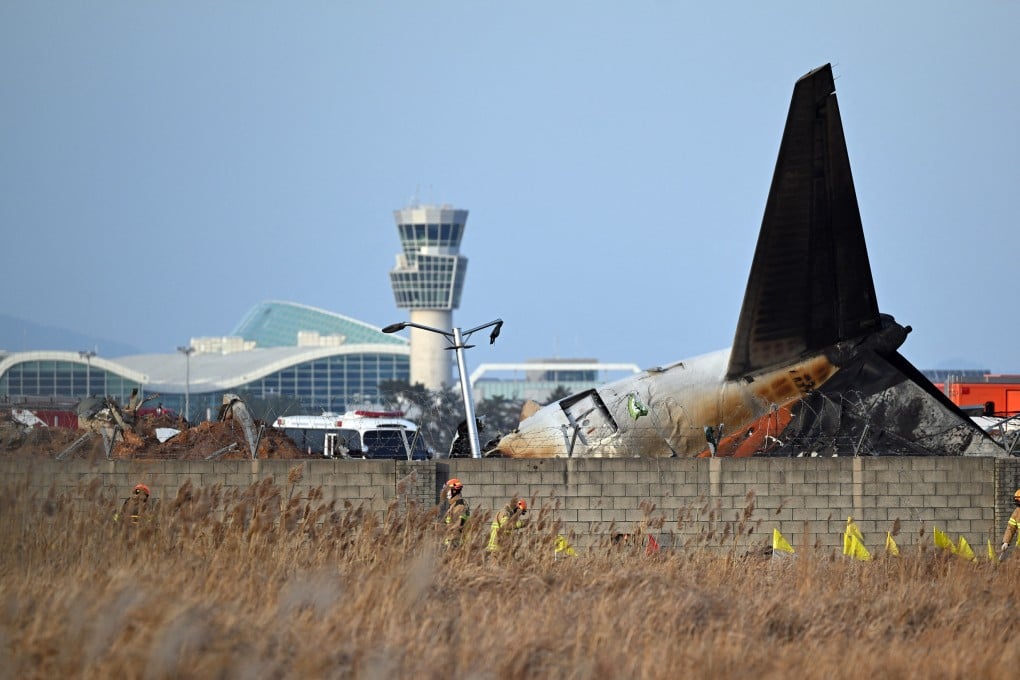 Recovery teams work at the scene where a Jeju Air Boeing 737-800 series aircraft crashed and burst into flames at Muan International Airport in Muan, South Korea, on December 29. Photo: AFP/Getty Images/TNS