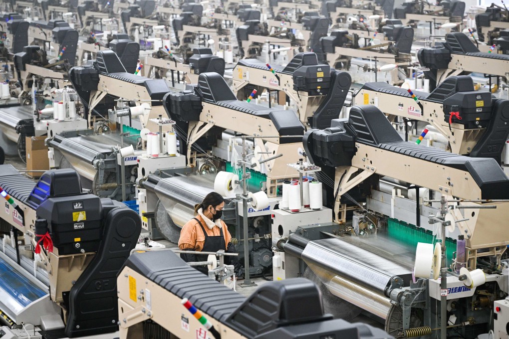 A woman works at a textile factory in China’s Jiangsu province last week. Photo: AFP
