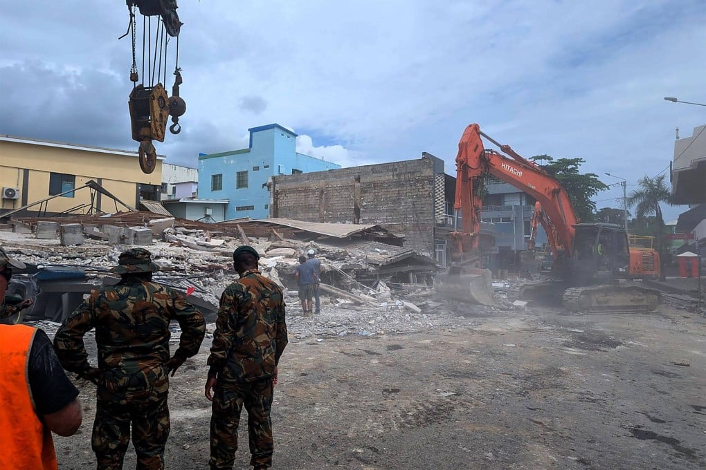 Rescue workers survey damage after an earthquake in Port Vila, the capital city of Vanuatu, on December 18, 2024. Photo: AFP