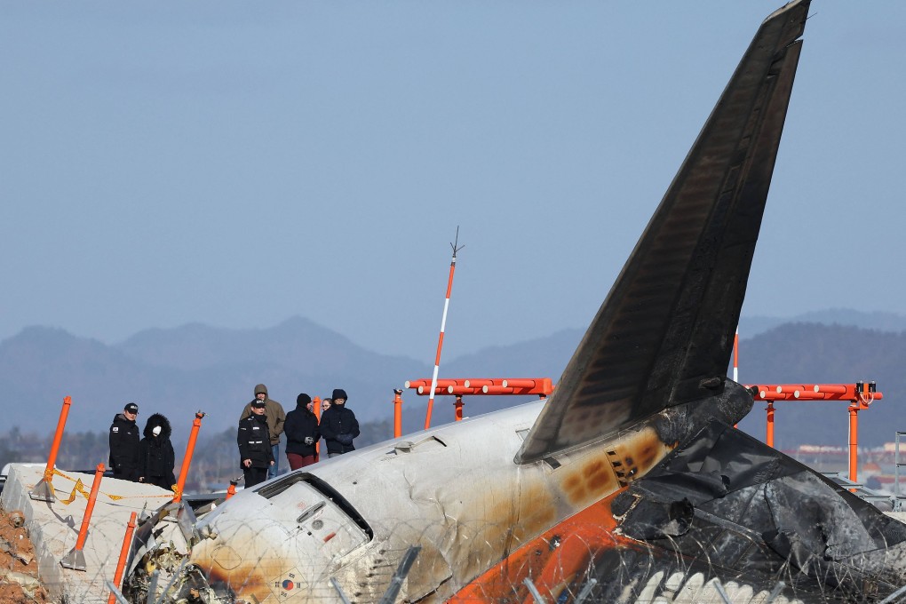 Investigators inspect the plane crash scene at Muan airport in South Korea on December 31. Photo: Yonhap/AFP