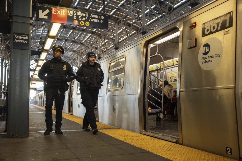 Police officers patrol the F train platform at the Coney Island-Stillwell Avenue Station in New York on Thursday. Photo: AP