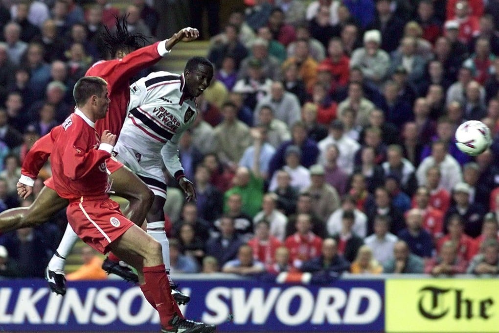 Manchester United striker Dwight Yorke (right) scores against Liverpool in May 1999. Photo: Reuters