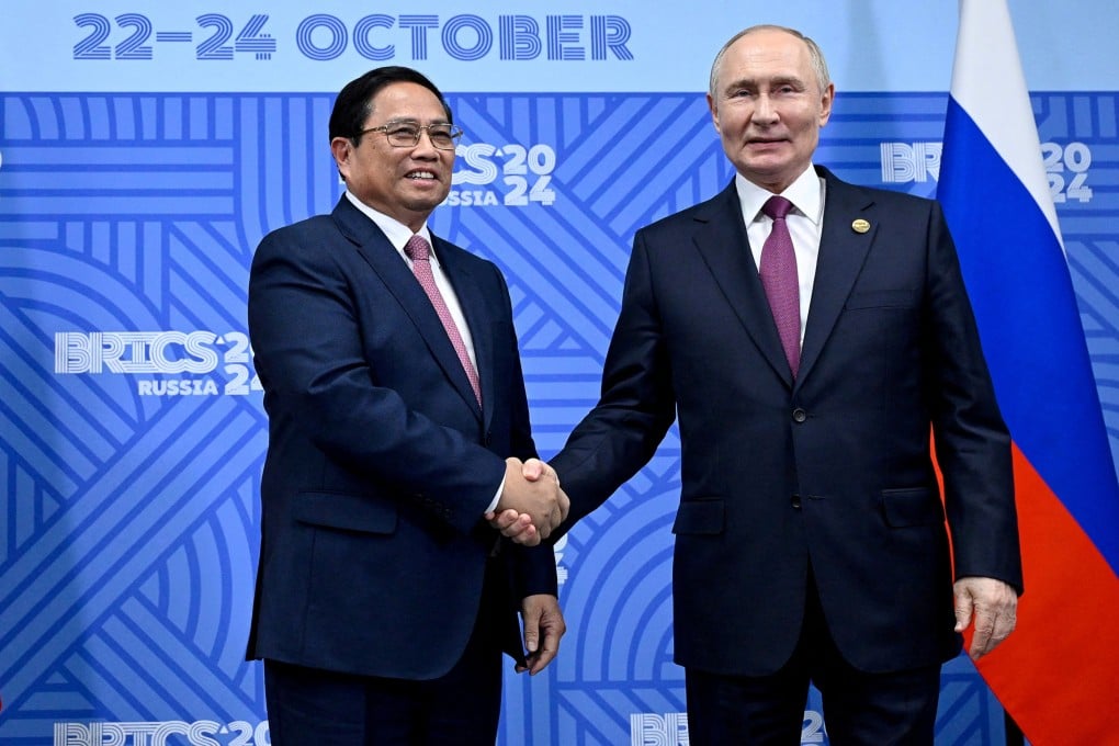 Russian President Vladimir Putin shakes hands with Vietnamese Prime Minister Pham Minh Chinh on the sidelines of the Brics summit in Kazan, Russia on October 24, 2024. Photo: Pool via Reuters