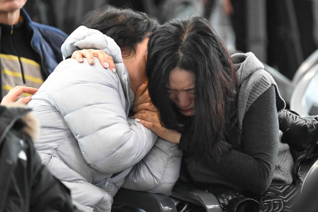 Jeju Air crash victims’ relatives at a makeshift shelter in Muan, South Korea. Photo: AFP
