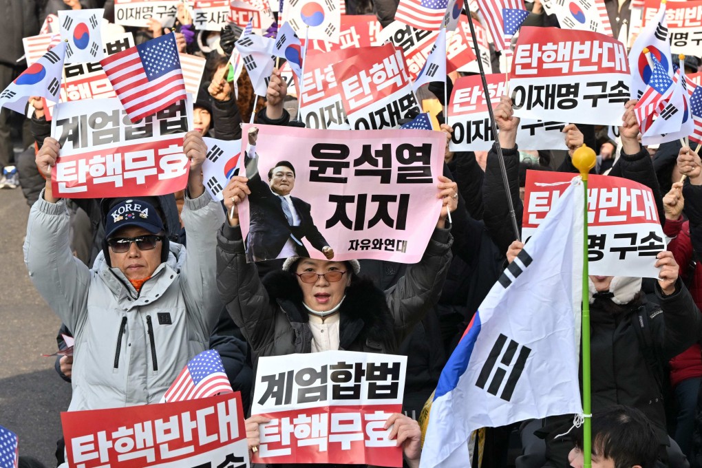 Supporters of impeached South Korean President Yoon Suk-yeol gather near his residence in Seoul on January 1. Photo: AFP