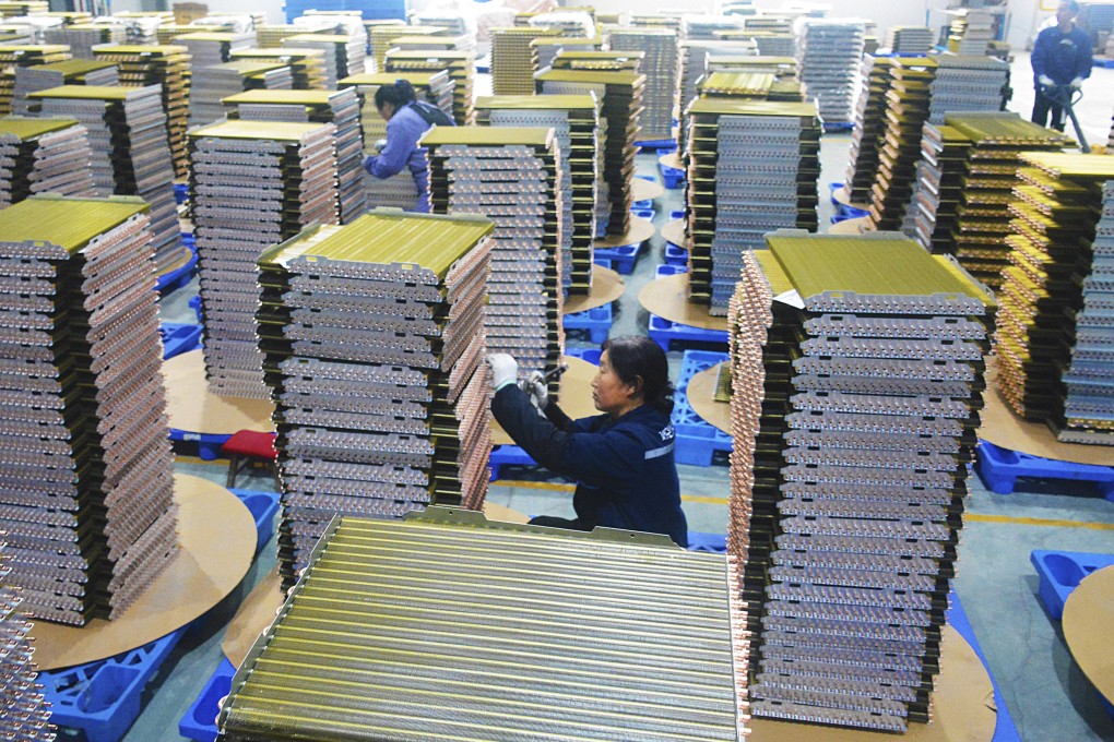 Staff handle coolant radiators for air conditioners at a factory in China’s Anhui province. Policymakers have vowed to expand a consumer-goods trade-in scheme this year. Photo: AP