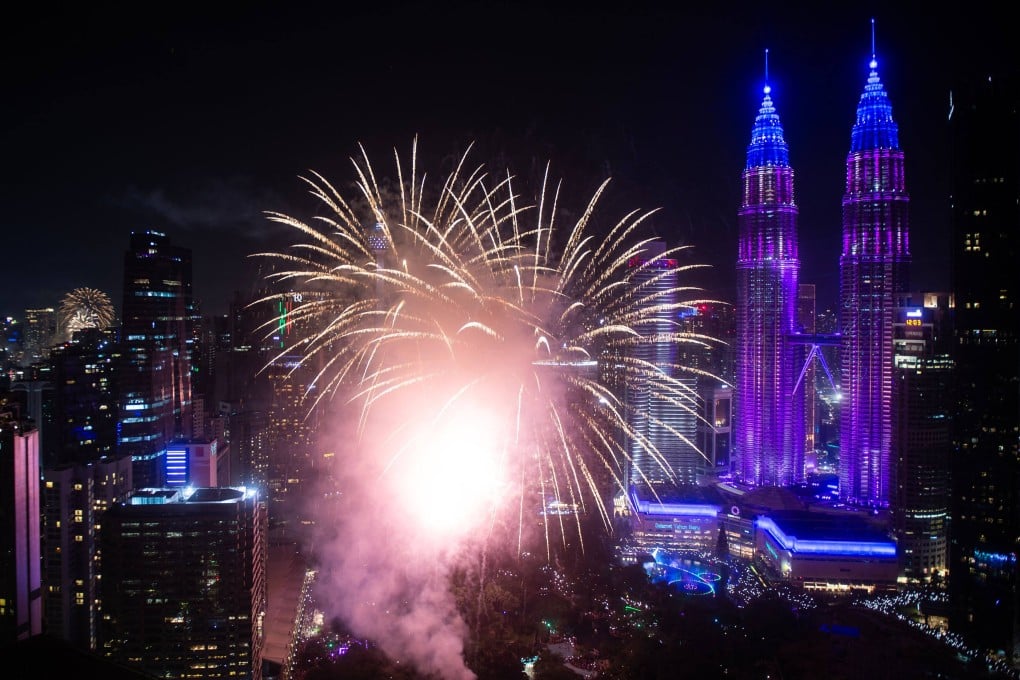Fireworks explode over the Petronas Twin Towers during the New Year celebrations in Kuala Lumpur, Malaysia, on January 1. Photo: AFP