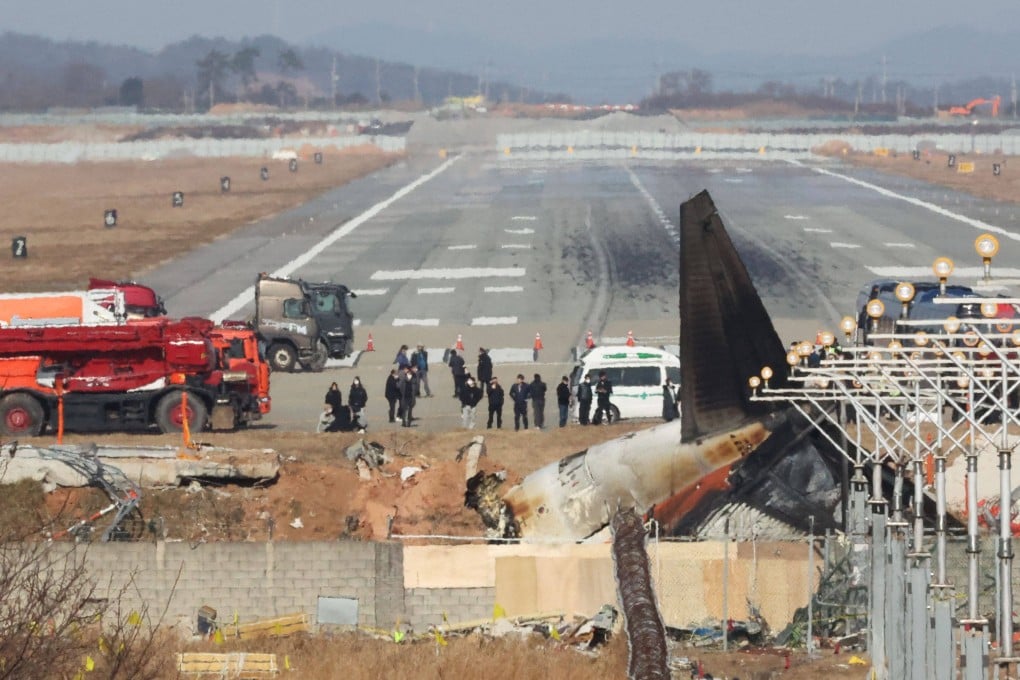 Relatives of the victims visit the Jeju Air crash site at Muan airport in South Korea on January 1. Photo: Yonhap/AFP
