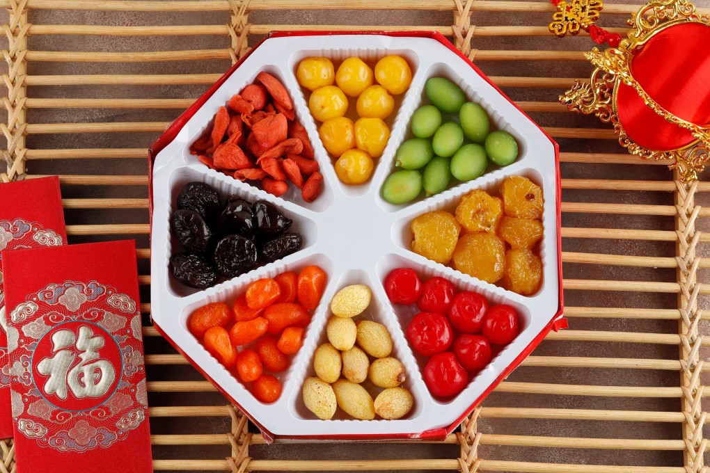 A traditional chuen hup usually has eight compartments, and the snacks within are collectively called the “Eight Sweets”. 
The typical line-up – all candied – consists of lotus root, lotus seeds, water chestnuts, winter melon, carrot slices, kumquat, coconut shreds and coconut wedges. Photo: Shutterstock