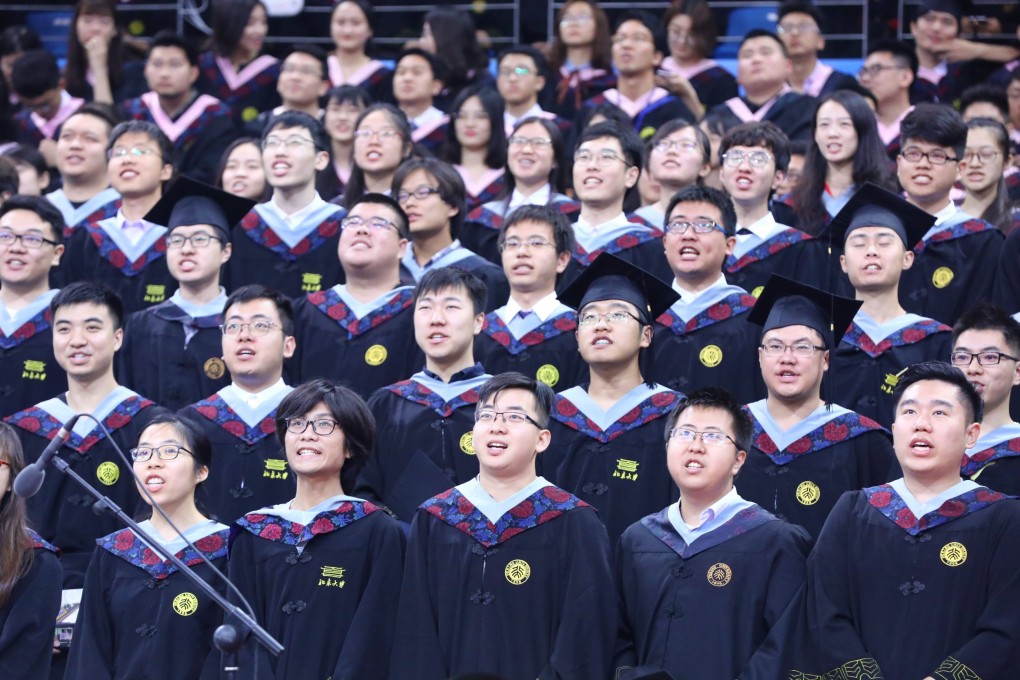 Graduates attend a commencement ceremony at Peking University. Chinese employers have been accused of “worshipping” graduates of the elite institution in Beijing. Photo: Xinhua