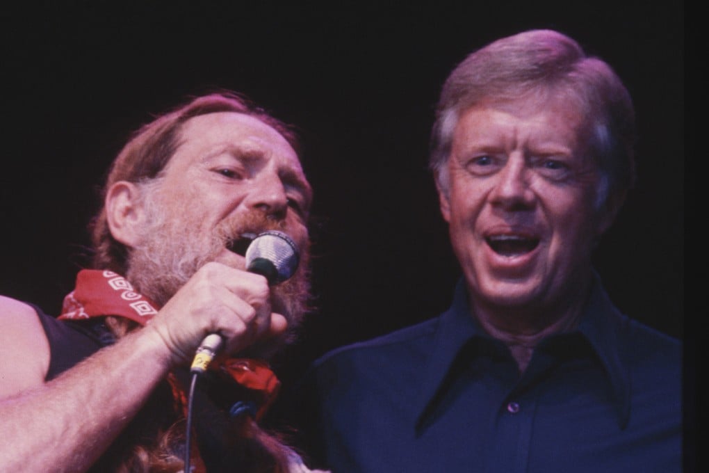 Then-US president Jimmy Carter (right) sings “Georgia on My Mind” with country music star Willie Nelson during a concert in Maryland in the United States in 1978. Photo: Getty Images