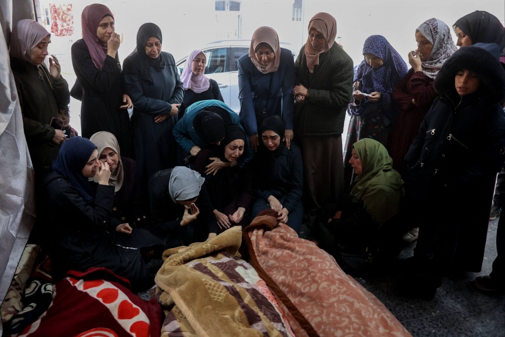 Palestinian women weep over loved ones killed after Israeli air strikes on Gaza City at Al-Ahli Arab hospital in December. Photo: AFP