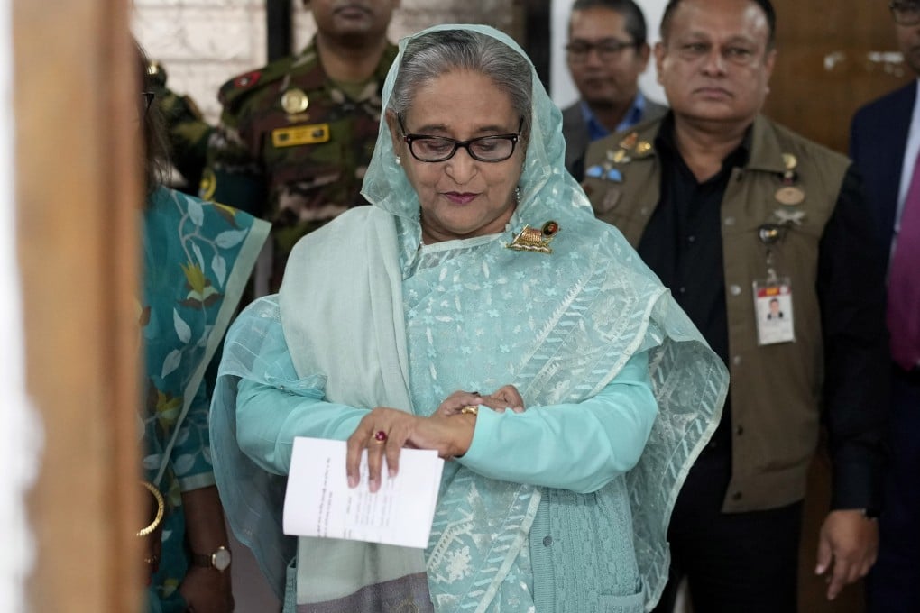 Former Bangladesh Prime Minister Sheikh Hasina checks her watch as she waits for the official opening time to cast her vote in Dhaka, Bangladesh, on January 7, 2024. Photo: AP