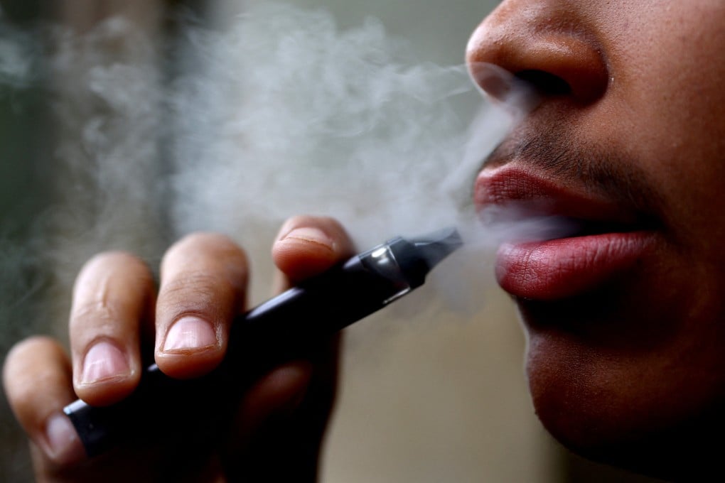 A man smokes a disposable vape. Tourists caught vaping in Vietnam face a fine, while those found selling the e-cigarettes face much bigger fines and jail terms of up to 15 years. Photo: Reuters