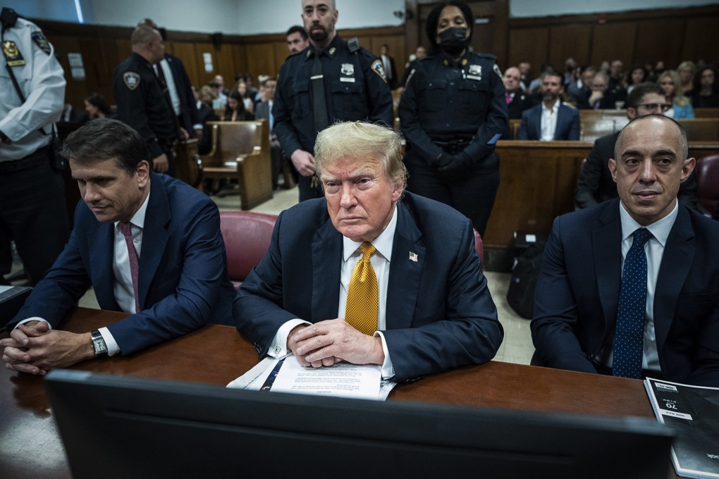 Donald Trump, centre, with lawyers Todd Blanche, left, and Emil Bove, attends his trial at Manhattan Criminal Court on May 29 in New York City. Photo: Getty Images / TNS