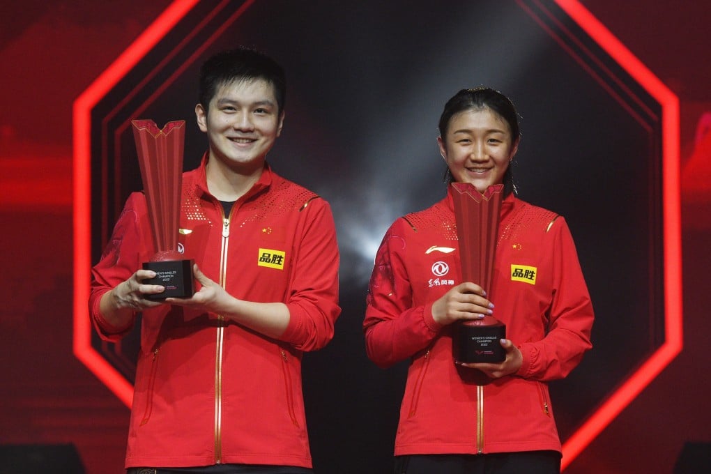 China’s Fan Zhendong (left) and his compatriot Chen Meng with their winning trophies at the WTT Singapore Smash 2022. Photo: Xinhua