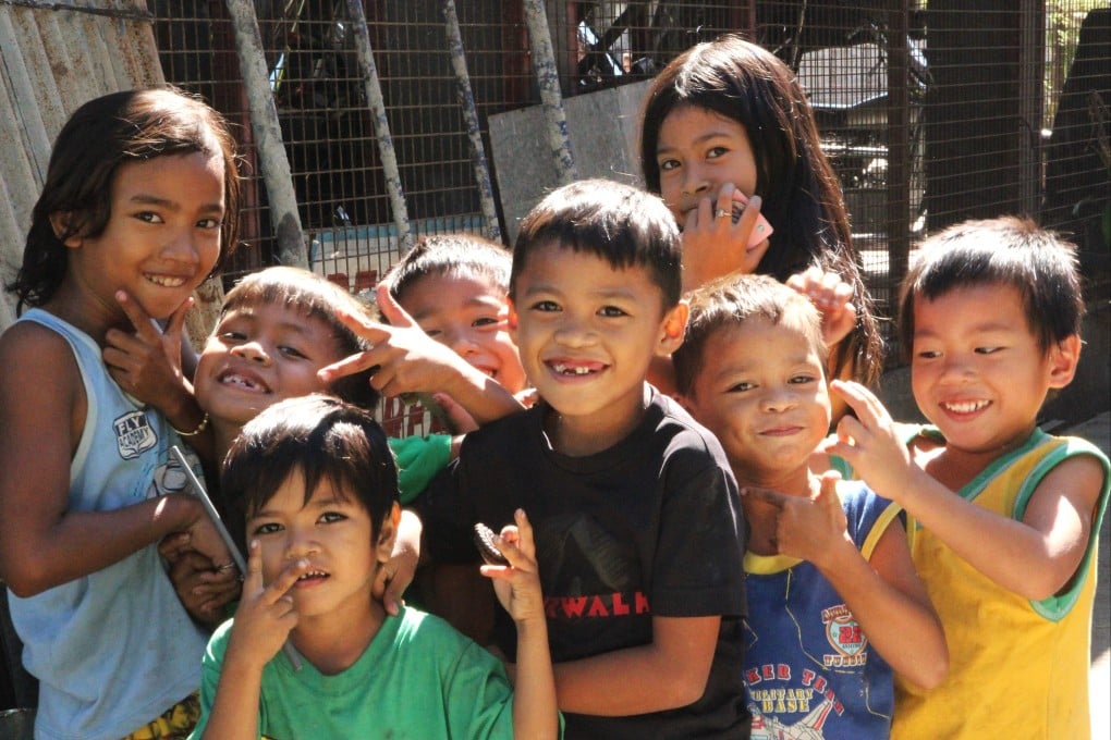 Burdened with violence and despair, few children finish primary school in Hadrian’s Extension, Angeles City. Photo: Huw Watkin