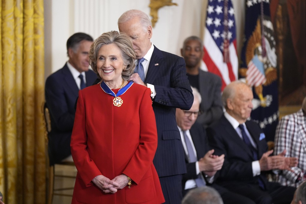 US President Joe Biden presents the Presidential Medal of Freedom to  Hillary Clinton, former secretary of state, at he White House in Washington on Saturday. Photo: AP