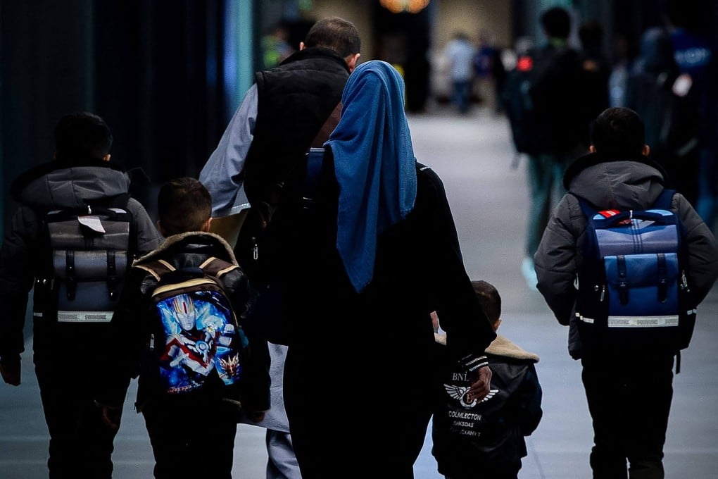Afghans arrive at an airport terminal on the Philippines’ Luzon island. Photo: US Embassy, Manila/AFP