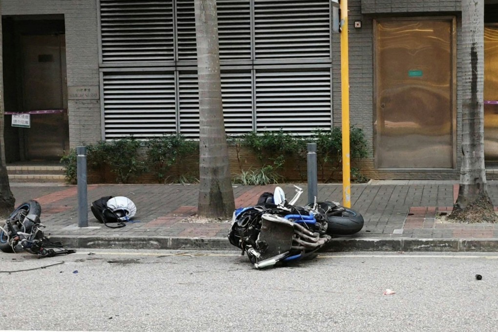The motorcycle veered out of control and collided with a roadside metal pole. Photo: Facebook/Dennis Lui