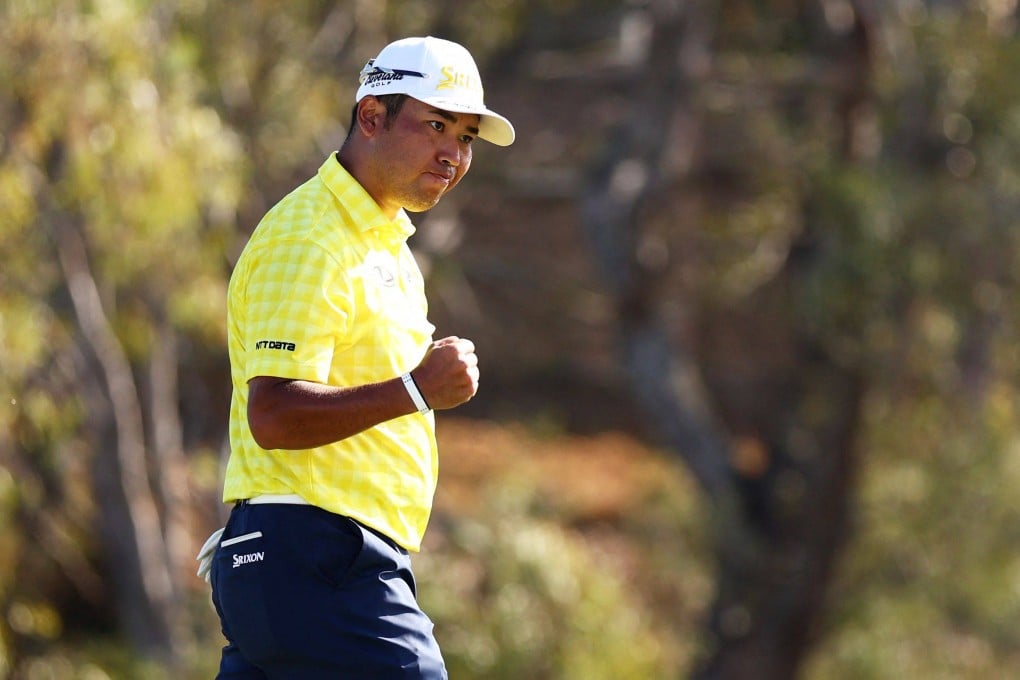 Hideki Matsuyama celebrates on the 18th green after making the record-breaking birdie putt at the Plantation Course of the Kapalua Golf Club on Sunday. Photo: AFP