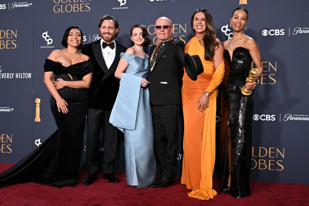 (From left) Mexican actress Adriana Paz, Venezuelan actor Edgar Ramirez, US singer and actress Selena Gomez, French director Jacques Audiard, Spanish actress Karla Sofia Gascon and US actress Zoe Saldana pose with the Golden Globe for best musical or comedy for Emilia Perez. Photo: AFP