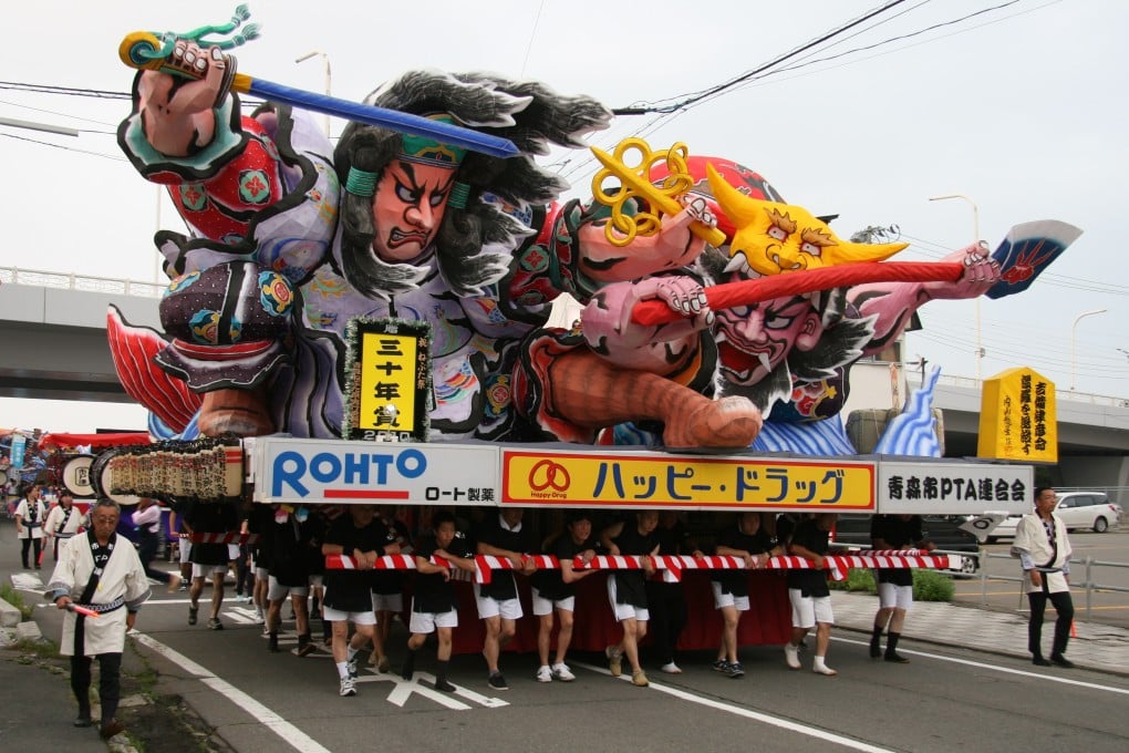A team carries a float in preparation for the Aomori Nebuta Festival, a summer fire festival in the northeastern prefecture of Aomori, Japan, in 2010. The sale of premium seats to such spectacles, marketed to foreigners, worries native Japanese. Photo: Shutterstock