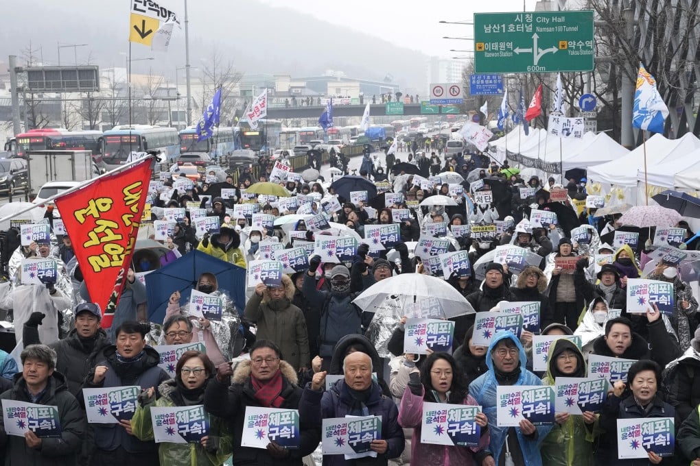 Protesters stage a rally demanding the arrest of impeached South Korean President Yoon Suk-yeol outside his residence in Seoul on Monday. Photo: AP