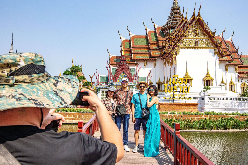 Chinese tourists pose for a group photo at Ancient Siam in Samut Prakan, Thailand on March 1, 2024. Photo: Xinhua