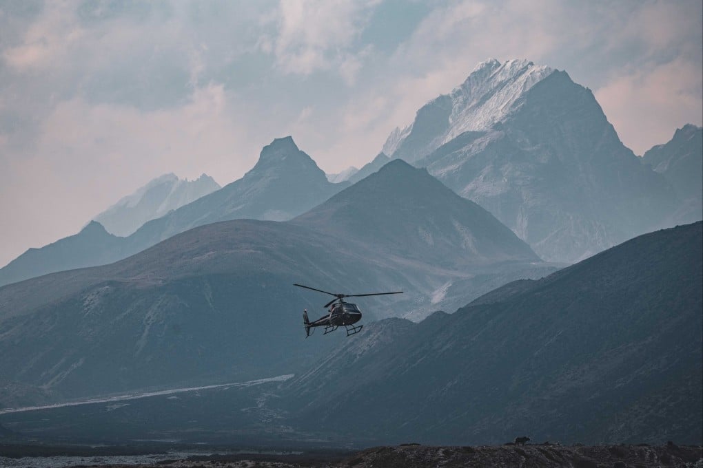 A helicopter flies around the Everest region in Nepal last year. Photo: EPA-EFE/Seven Summit Trek