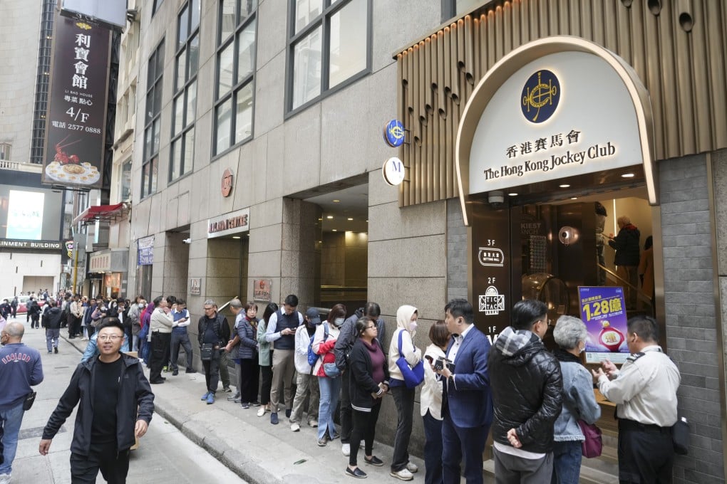 People line up outside the betting branch on Stanley Street, Central. Photo: Sam Tsang