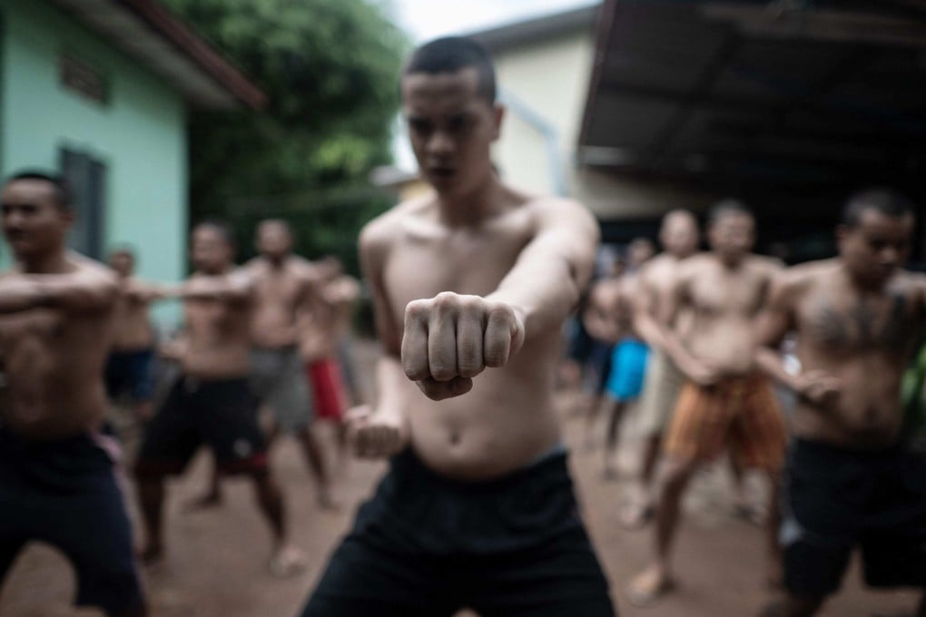 Recovering drug addicts exercise during a rehabilitation program at the Metta Saneain rehab centre in Yangon, Myanmar. Photo: AFP