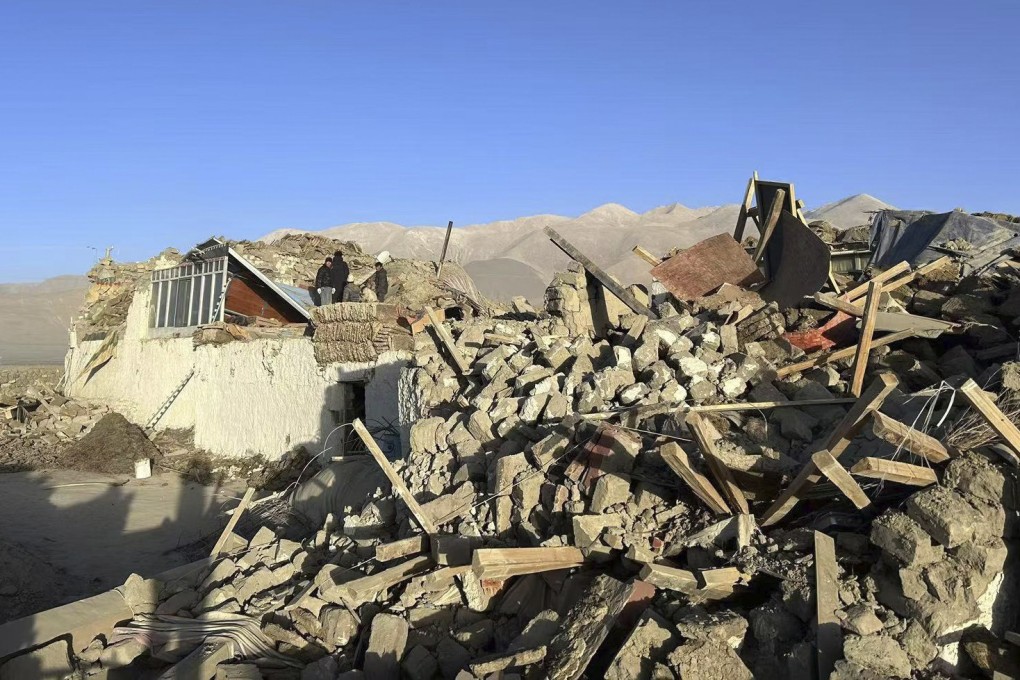 People sift through rubble in the aftermath of a magnitude 6.8 earthquake in China’s southern Tibet autonomous region on Tuesday morning. Photo: Xinhua