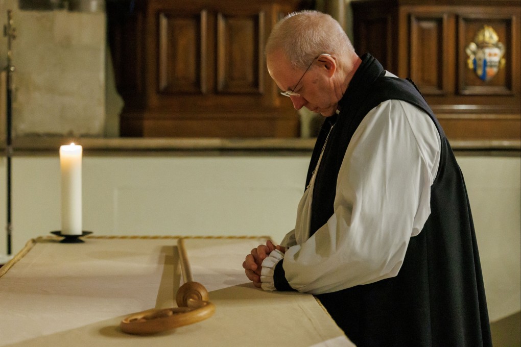 Archbishop of Canterbury Justin Welby lays down his pastoral staff, a symbolic act marking the end of his ministry. Photo: Neil Turner for Lambeth Palace via Reuters