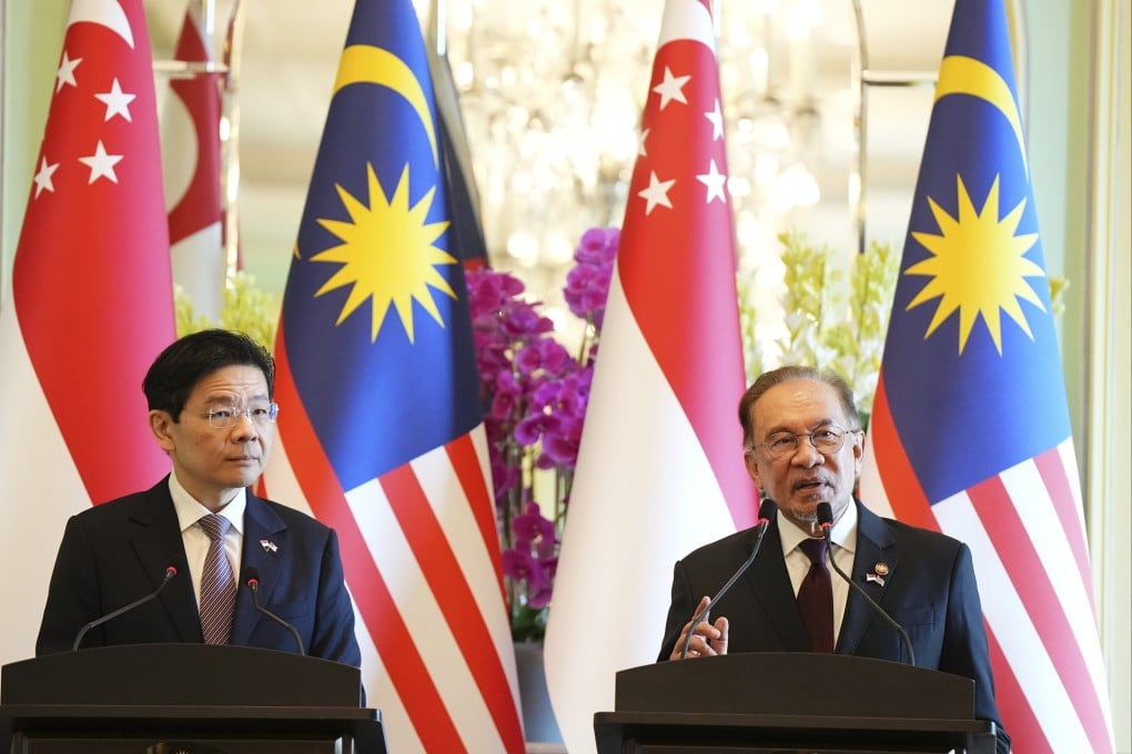 Malaysian Prime Minister Anwar Ibrahim speaks during a press conference with Singapore Prime Minister Lawrence Wong in Putrajaya on Tuesday. Photo: AP