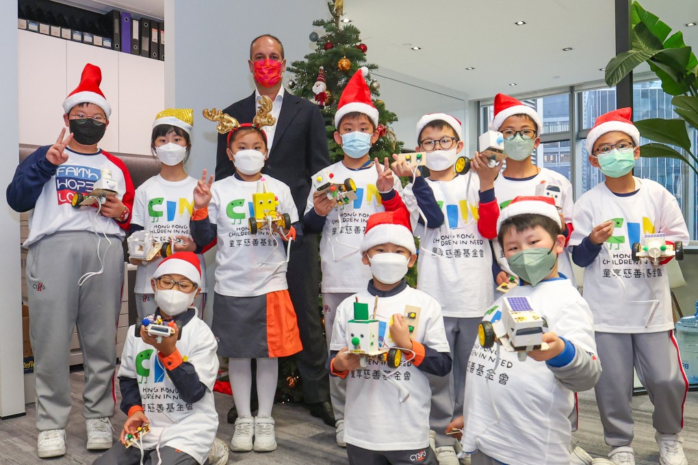 Kurt Ersoy, CEO of Segantii Capital Management, with kids of the Hong Kong Children in Need Foundation. Photo: Edmond So