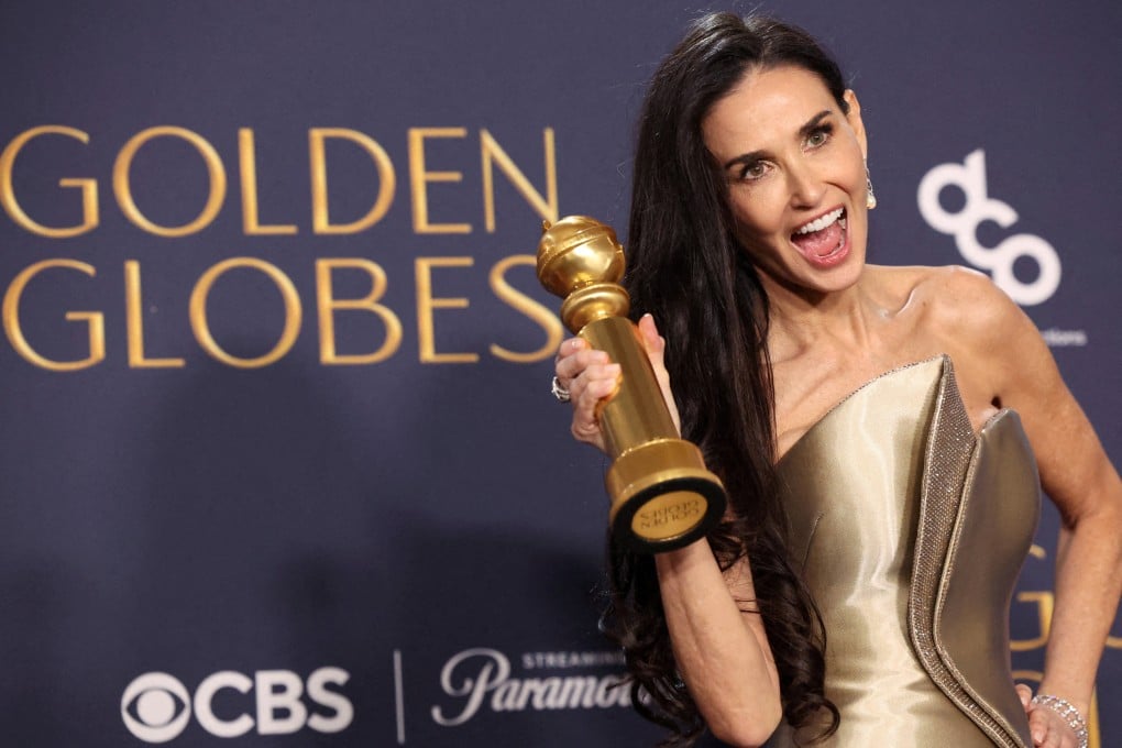 Demi Moore poses with the award for best actress in a musical or comedy, for The Substance, at the Golden Globes. Photo: Reuters