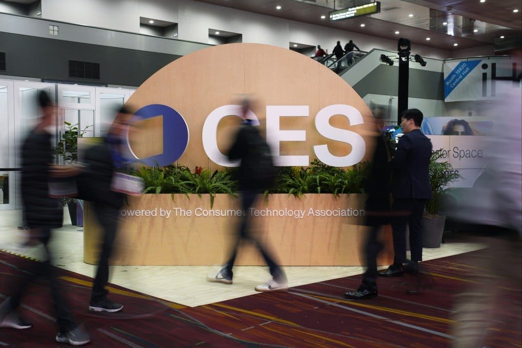 People walk by a sign ahead of the CES 2025 tech show in Las Vegas. Photo: AP