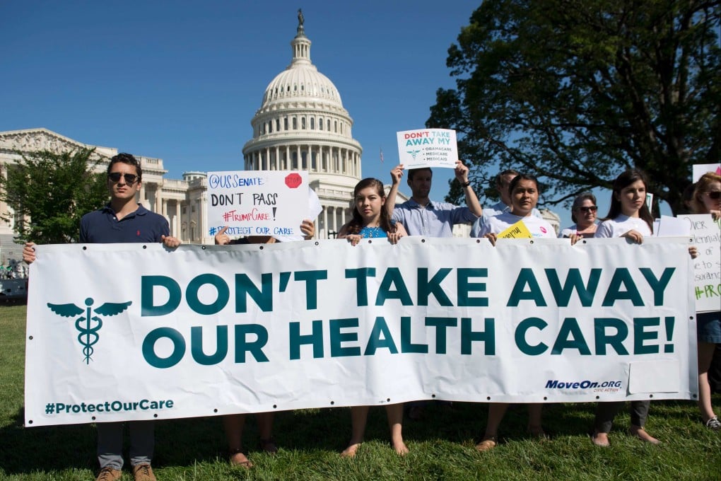 Protesters against the US Senate Republicans’ healthcare bill hold a rally outside the US Capitol in Washington, DC in June 2017. Photo: AFP