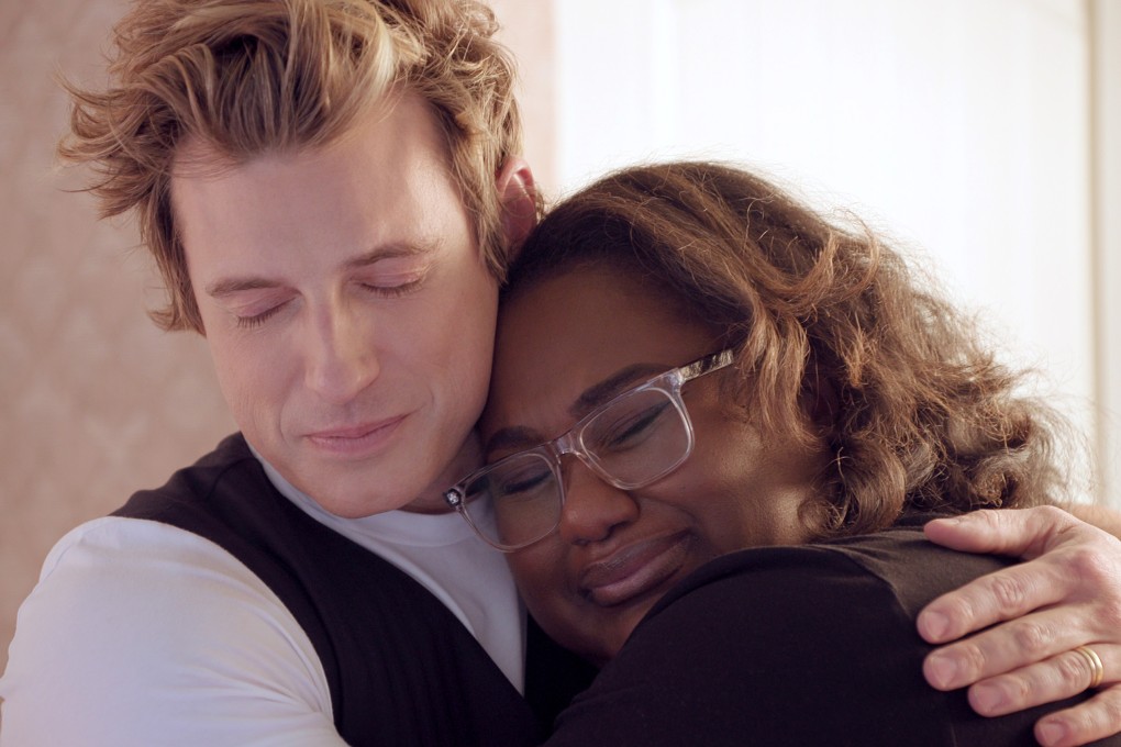 Queer Eye interior designer Jeremiah Brent hugs a participant in the new season of the Netflix show. He reveals how he renovates homes in days. Photo: TNS