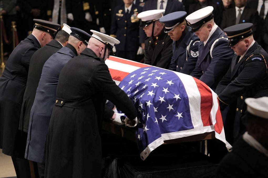 A military honour guard places the flag-draped casket of former US president Jimmy Carter in the US Capitol in Washington on Tuesday. Photo: EPA-EFE