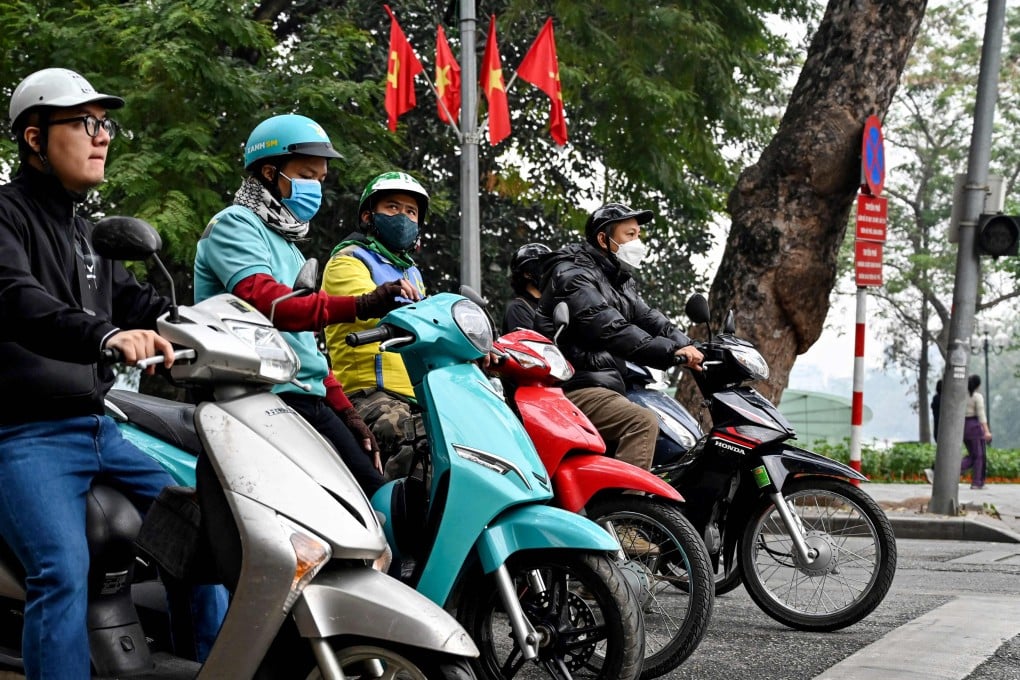 Motorists wait at a red light at an intersection in Hanoi on Wednesday. Photo: AFP