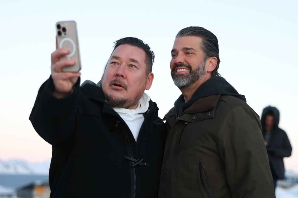 Donald Trump Jnr (right) poses for a photo as he arrives in Nuuk, Greenland, on Tuesday. Photo: Ritzau Scanpix via AP