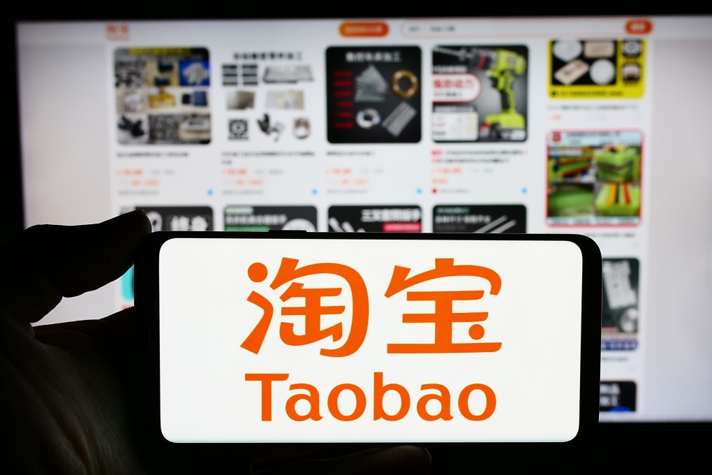 The Taobao logo is seen on a smartphone in front of its website in this arranged image taken November 6, 2023. Photo: Shutterstock Images