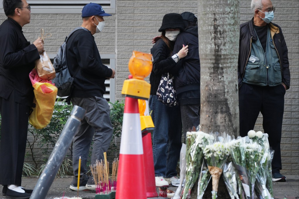 Family members and friends attended a roadside memorial for the deceased motorcyclist in Kowloon Bay on January 8, 2024. Photo: Sam Tsang