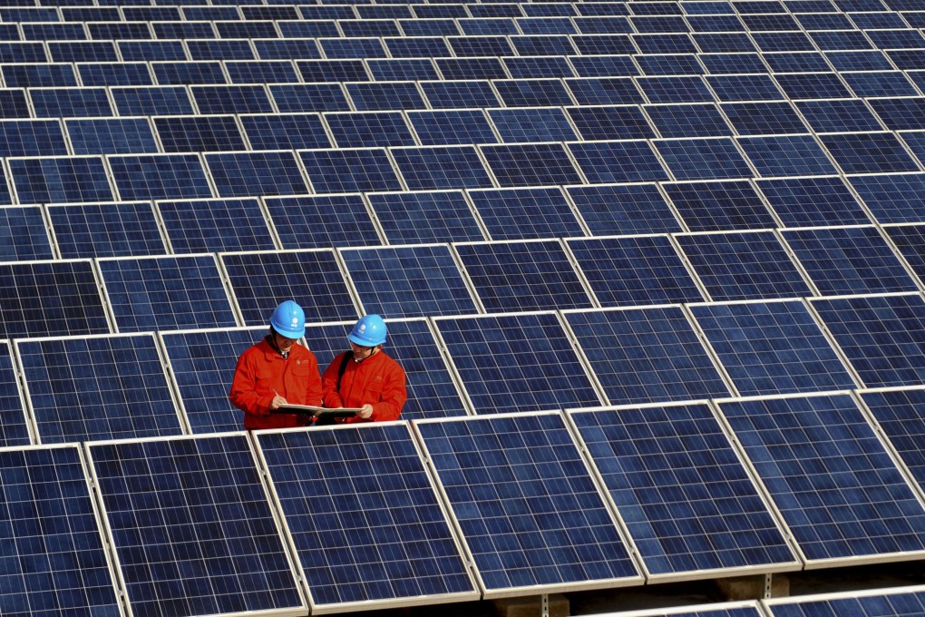 Workers check solar panels at a solar power station on a factory roof in Changxing, eastern China’s Zhejiang province in 2012. Like many other sectors in China, the solar industry has become a global powerhouse but faces headwinds from punitive tariffs abroad to a brutal price war at home. Photo: AP