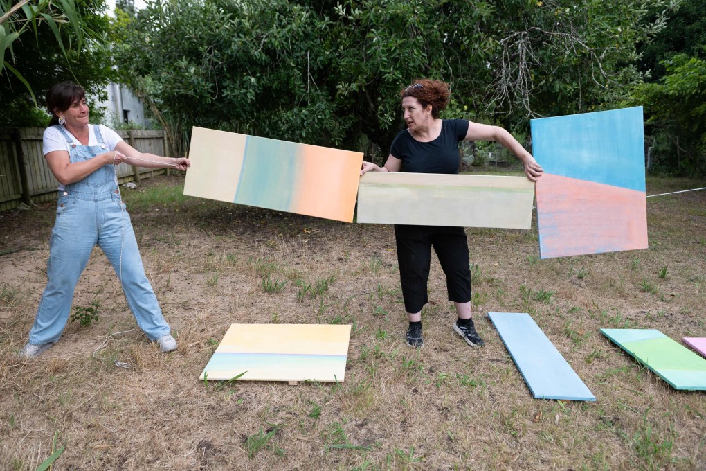 Moroccan artist Myriam Zini (right) prepares her installation ahead of the Campo Artfest in Pueblo Garzón, Uruguay. The small rural town in the South American country has become a magnet for international artists through its annual festival. Photo: AFP