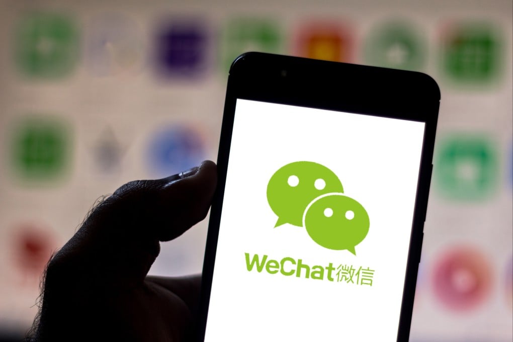 The WeChat logo is displayed on a smartphone screen in this arranged photograph. Photo: Shutterstock
